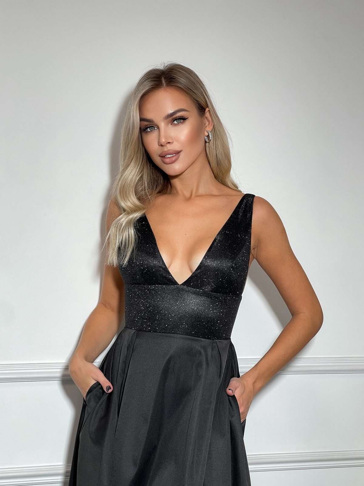 Sparkly Glitter Deep Neckline and Open Back Dress with High-Low Pleated Skirt and Pockets In Black